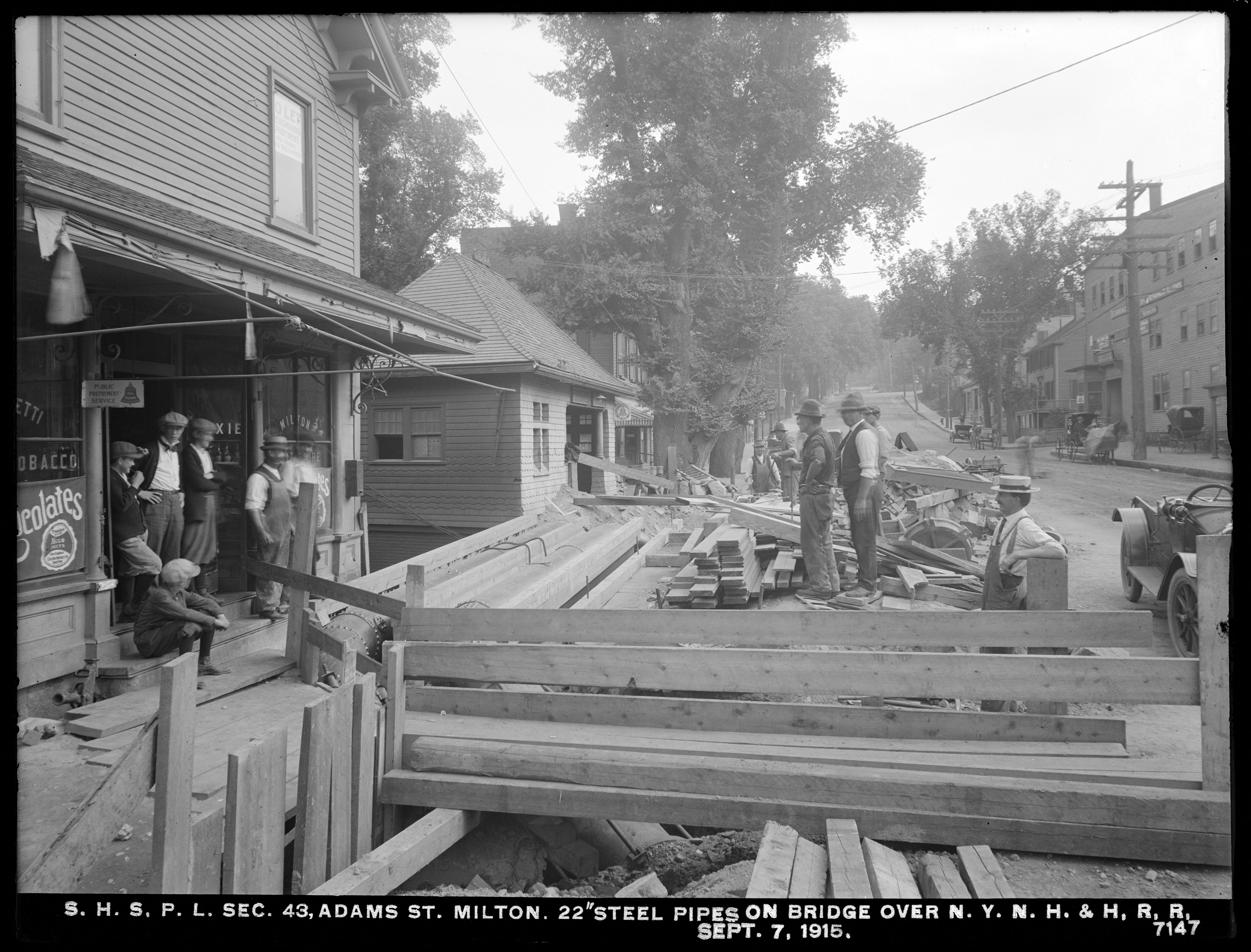 Distribution Department, Southern High Service Pipe Lines, Section 43, 22-Inch Steel Pipes on Bridge at Adams Street over New York, New Haven and Hartford Railroad, Milton, Mass., Sep. 7, 1915
