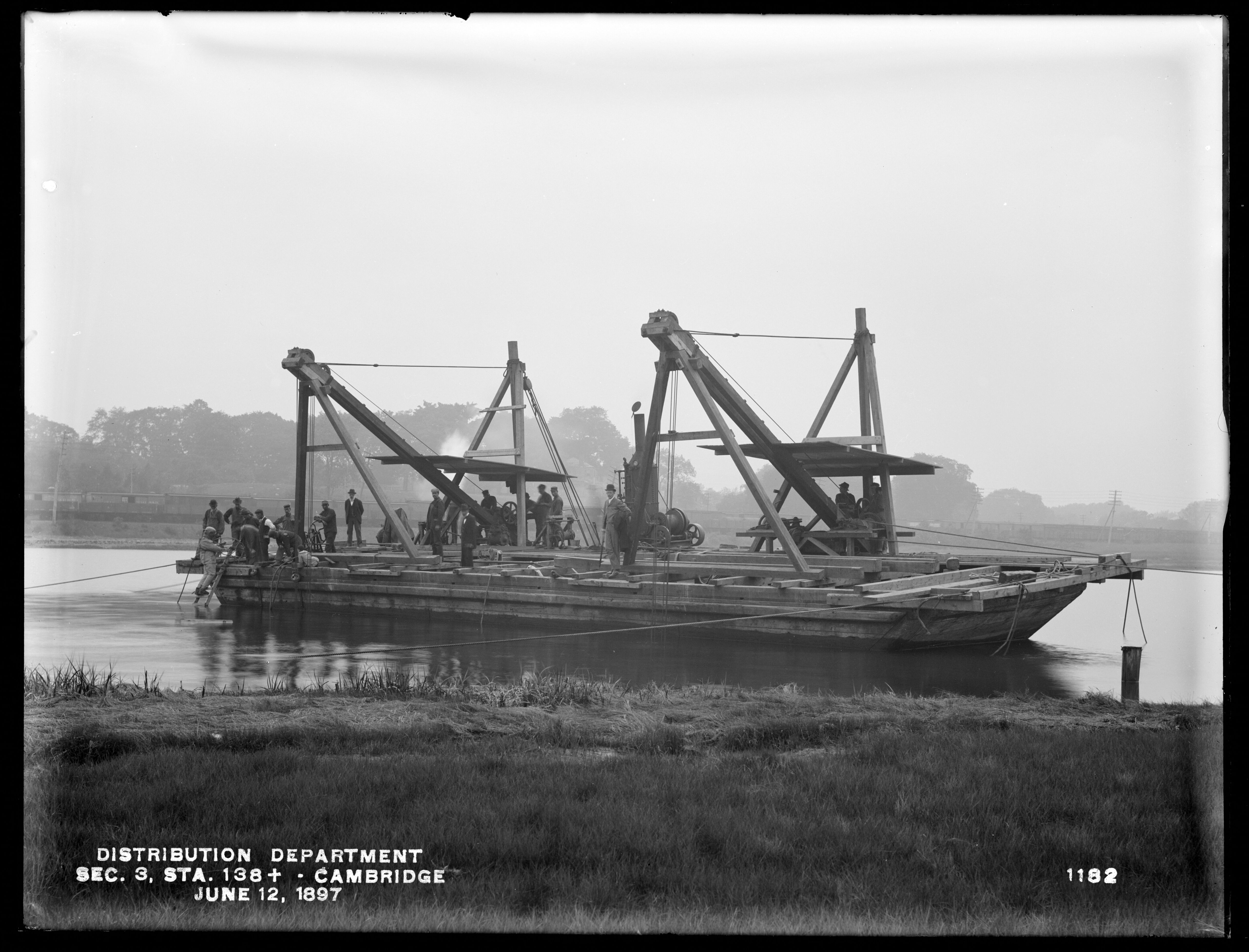 Scow at the Foot of Magazine Street, with Diver Preparing to Descend, Station 138+, Cambridge, Mass., Jun. 12, 1897
