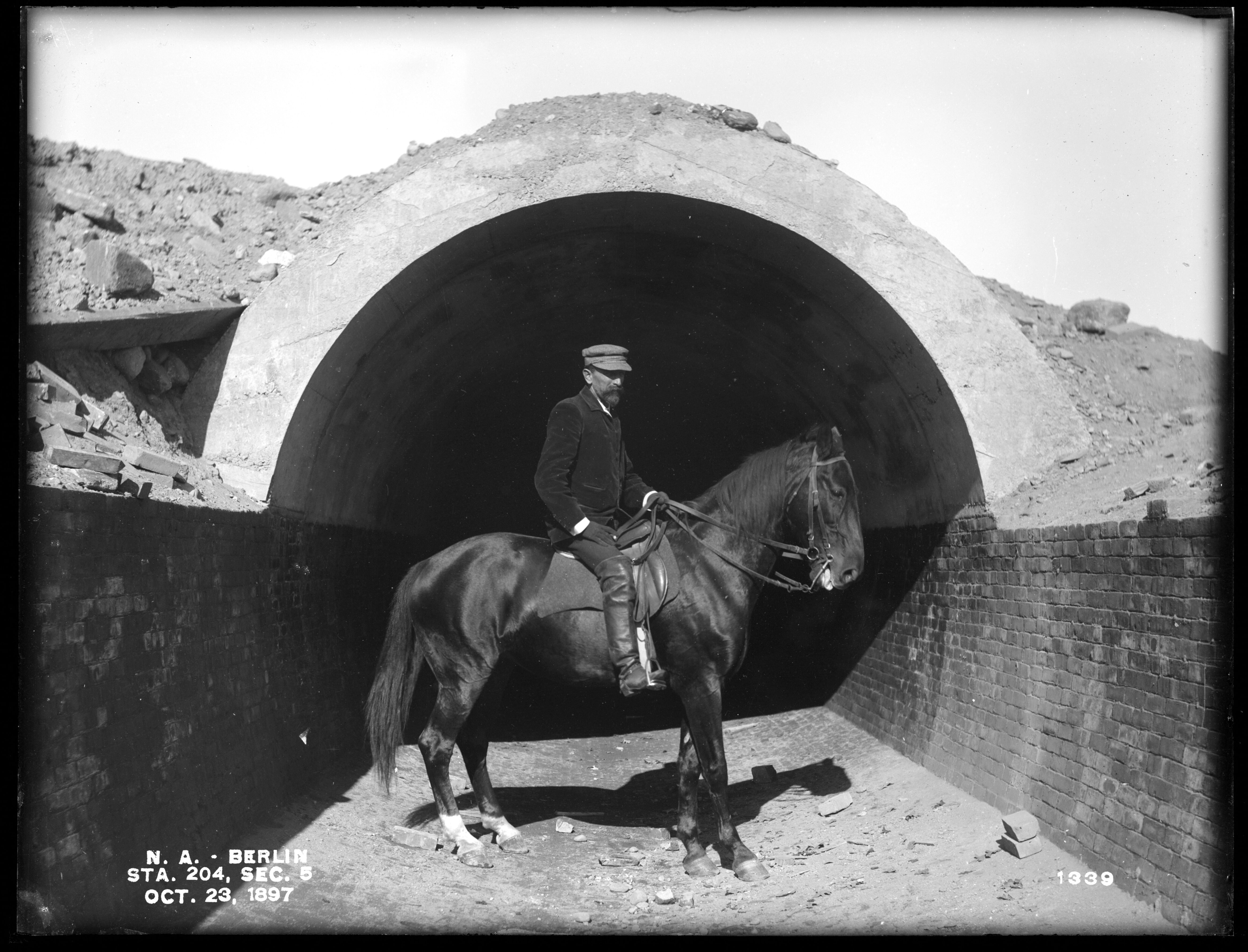 Wachusett Aqueduct, Section of Aqueduct, with Mr. Silvio Casparis on Horseback, Section 5, Station 204, Berlin, Mass., Oct. 23, 1897
